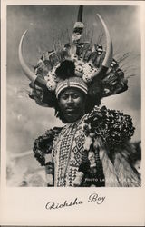 Ricksha Boy' - old black and white photo of man in ceremonial headwear. Postcard