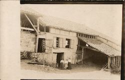 Women Standing Outside a Barn - European Postcard