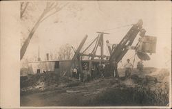 Group of men in front of large steam shovel excavator Postcard