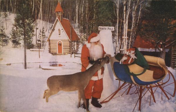 Santa Feeds a Native Deer as He Packs His Sleigh at the North Pole ...