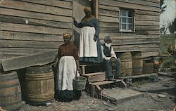 Three African Americans on the Steps of a Wooden House Postcard