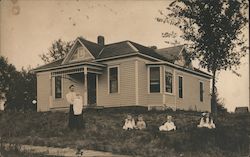 Farmhouse with Woman and Five Children Postcard