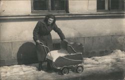 Woman Pushing Baby Carriage in Snow Women Postcard Postcard Postcard