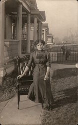 Woman Sitting on Chair in Yard in Front of Porch Women Postcard Postcard Postcard