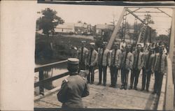 Firemen with Axes on Bridge Postcard