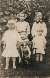 Family photo of four children and a dog. Postcard Postcard Postcard