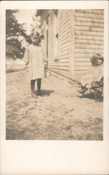 Two Girls in White Outside House Postcard