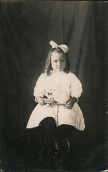 Little Girl in White Dress Sitting on Stool Postcard