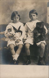 Young Boy and Girl Each Holding Teddy Bears Postcard