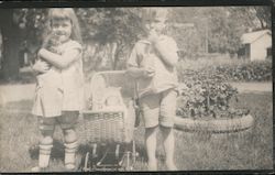 Boy and Girl Standing next to Crib Postcard