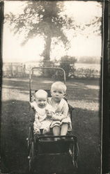 Young Boy and Baby Sitting in Stroller Postcard