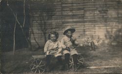 Two Cute Kids Sitting on Old Cart Children Postcard Postcard Postcard