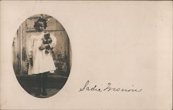 Girl in White Dress Holding a Teddybear Postcard