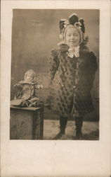 Child in Big Coat Standing next to a Doll Children Postcard Postcard Postcard