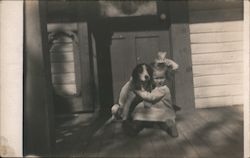 Little Girl Playing with Dog Postcard