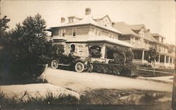 Touring Car with People Outside House Postcard