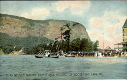 Chas. Nelson making Canoe Mile record on Moosehead Lake Postcard