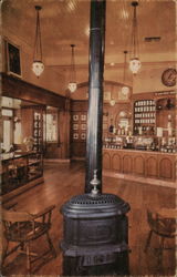 Pot-bellied stove and hanging chandeliers set the mood of Upjohn's old-fashioned drugstore Postcard