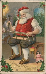 A Merry Christmas, Santa Building a Toy Santa Claus Postcard Postcard Postcard