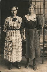 Two women with linked arms, Studio Photo Postcard