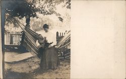 Woman holding a Baby Postcard