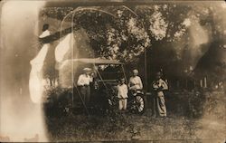 A Man, 2 Women and a Boy Posing in Front of a Car Cars Postcard Postcard Postcard