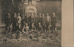 Group of men wearing suits at Grave or Park Postcard