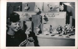 Woman with Ballerina Dolls in Store Window Bernard Ravca Postcard