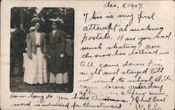 Two woman in long dresses and large hats Postcard