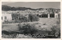 Scene in the Indian Village with Furnace Creek Inn in the Distance Death Valley, CA Postcard Postcard Postcard