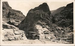 Car driving through Tirus Canyon Postcard