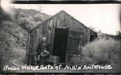 Gordon Walker Rests at Main Entrance - Original Castle Death Valley, CA Postcard Postcard Postcard