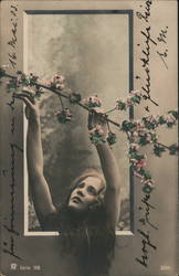 Young Woman Reaching for Flower Branch: Serene Moment Postcard