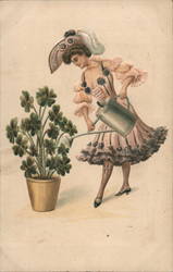 Woman Watering planter of Shamrocks Postcard