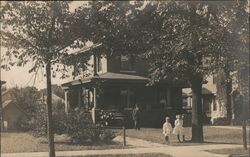 Family in front of House Postcard