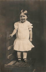 Toddler in white dress on chair Children Postcard Postcard Postcard