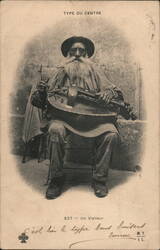 French Hurdy Gurdy Player Postcard