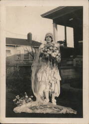 Vintage Bride holding flowers in front of home Original Photograph