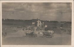 Two antique cars in front of farmhouse Postcard