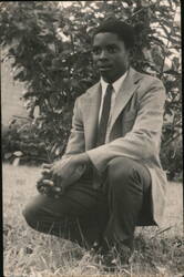 Young Black man wearing jacket and tie Original Photograph