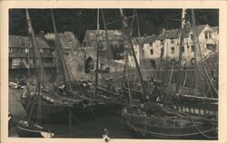 Sail boats/ships docked at port with stone buildings Postcard