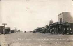 Main St. Looking S. Showing Bullet Holes in Building at Arrow Postcard