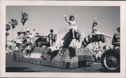 Float with women riding giant bees, accordion player, vintage car Original Photograph