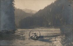 Woman in Rowboat on St. Joe River, Idaho Postcard