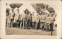 Group of Men in Uniform with Civilians in Tent Encampment Postcard