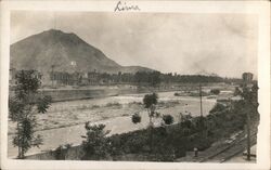 View along the river, from the F.C.C. Railroad exit near Lima Peru Postcard