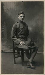 World War I Soldier Seated Portrait Postcard