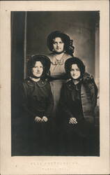 Three Women Wearing Bonnets Postcard