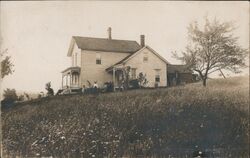 White Farmhouse on a Hill Postcard