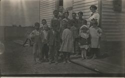 Group of Children in Front of Schoolhouse Postcard